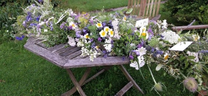 Meadow style deconstructable funeral casket spray Floral Acre Somerset